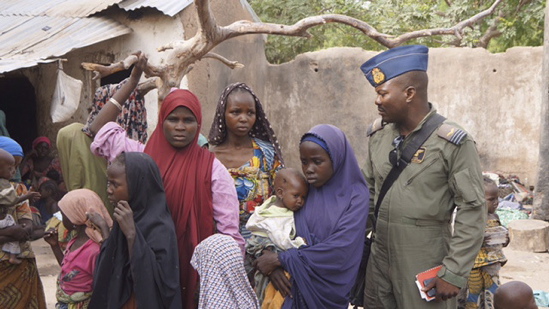 A Nigerian army soldier talks with hostage women and children who were freed from Boko Haram on Wednesday. Nigeria’s military rescued another set of women and children who had been kidnapped by Boko Haram militia and were being detained in the Sambisa forest where the Islamist group has been holed up, an army spokesman said Thursday.