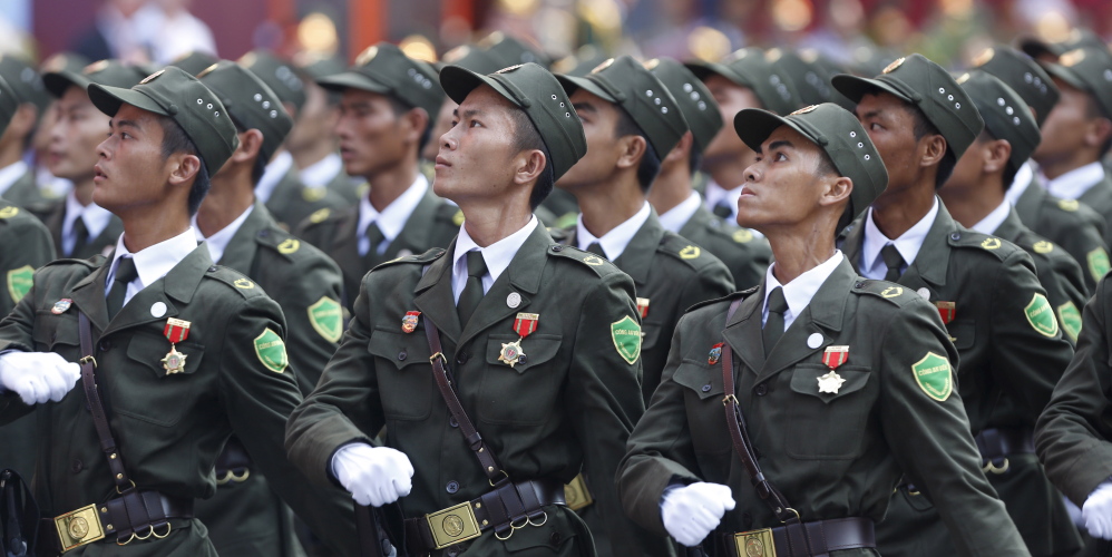 Village policemen march during a military parade to mark the 40th anniversary of the fall of Saigon in Ho Chi Minh City, Vietnam, on Thursday. The capture of Saigon by North Vietnamese forces ended a war that lasted 30 years.
