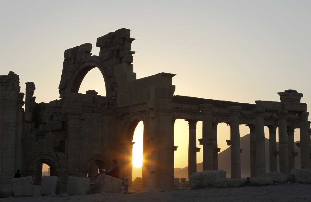 The sun sets behind ruined columns at the historical city of Palmyra, in the Syrian desert, some 150 miles northeast of the capital of Damascus. Reuters