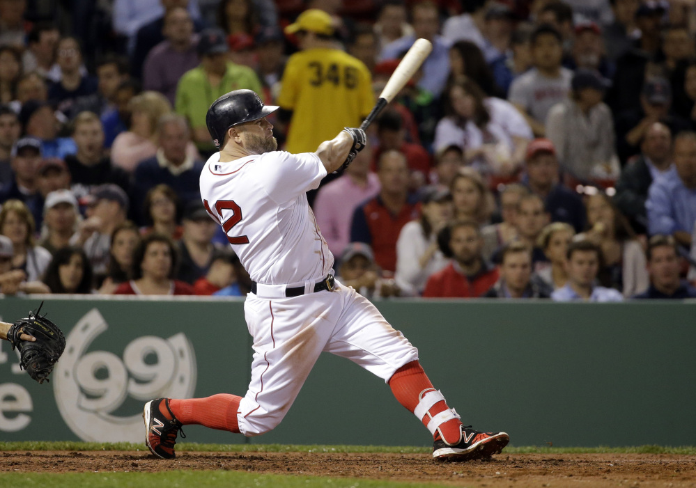 Boston’s Mike Napoli hits a solo homer in the fourth inning Tuesday night, his fourth home run of the season.