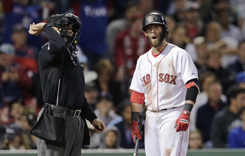 Boston’s Dustin Pedroia argues a called third strike with home plate umpire Mark Wegner after striking out against Texas Rangers relief pitcher Keone Kela in the eighth inning of Thursday night’s 3-1 loss.