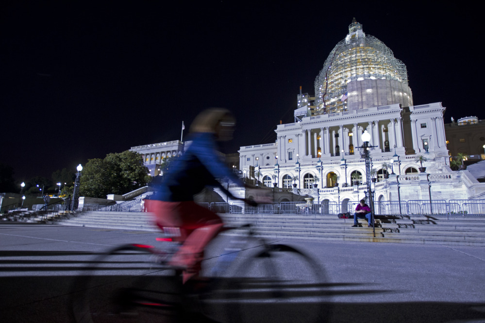 The U.S. Capitol is illuminated Friday night as the Senate works late on important bills that require action.