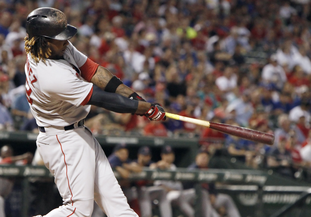 Red Sox designated hitter Hanley Ramirez hits a solo home run in the sixth inning of Thursday night’s game against the Texas Rangers. The home run helped Boston to a 5-0 win.