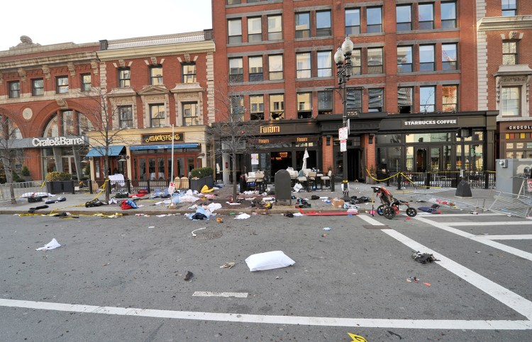 This April 15, 2013, forensics photograph made by the FBI and presented in federal court as evidence during the penalty phase of convicted Boston Marathon bomber Dzhokhar Tsarnaev's trial, shows the scene where the second bomb exploded on Boylston Street near the marathon finish line in Boston. Three people were killed and more than 260 others were wounded when twin bombs exploded. 