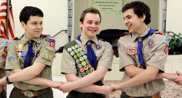 Pascal Tessier, center, takes part in an activity with fellow scouts Matthew Huerta, left, and Michael Fine, right, after he received his Eagle Scout badge in Chevy Chase, Md., in February 2014. Last month, the Boy Scouts' New York chapter announced it hired Tessier, the nation's first openly gay Eagle Scout, as a summer camp leader, in defiance of the national scouting organization's ban on openly gay adult members. 