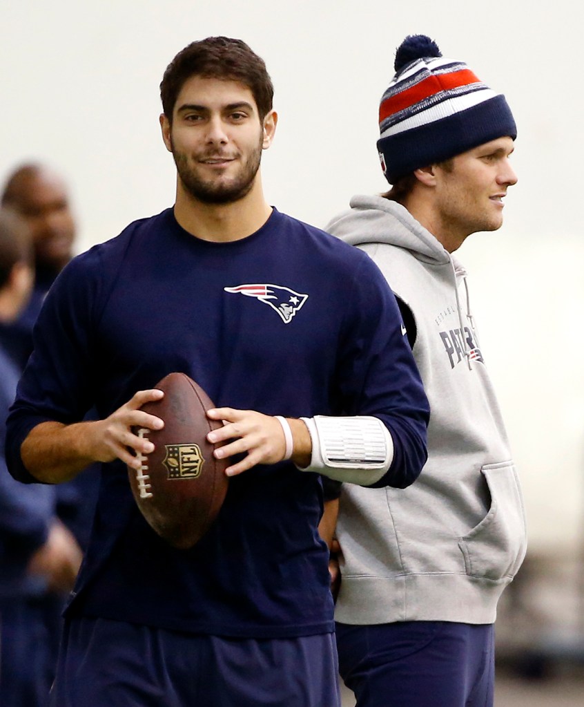 Patriots backup quarterback Jimmy Garoppolo, left, and  quarterback Tom Brady, stand by during a practice walk-through at the team's facility in Foxborough, Mass., in this Jan. 23, 2015,  photo.
The Associated Press