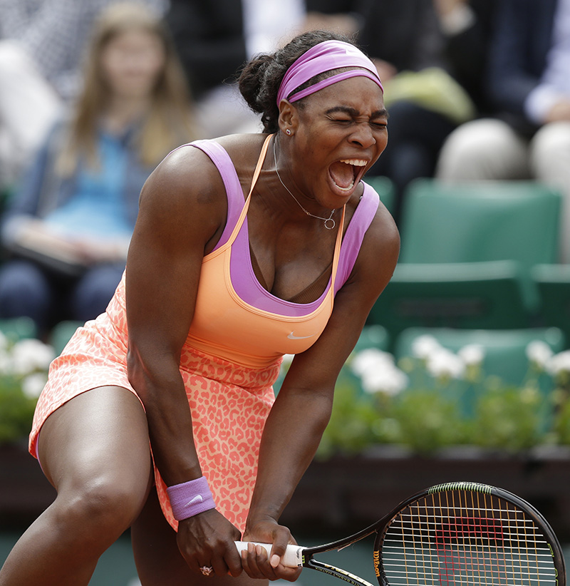 Serena Williams of the U.S. screams in the second round match of the French Open tennis tournament against Germany's Anna-Lena Friedsam at the Roland Garros stadium, in Paris, France, Thursday, May 28, 2015. Williams won in three sets 5-7, 6-3, 6-3. (AP Photo/Thibault Camus)