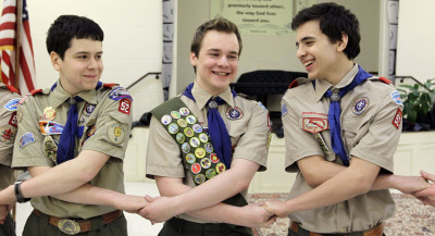 Pascal Tessier, center, takes part in an activity with fellow scouts Matthew Huerta, left, and Michael Fine, right, after he received his Eagle Scout badge in Chevy Chase, Md., in February 2014. Last month, the Boy Scouts' New York chapter announced it hired Tessier, the nation's first openly gay Eagle Scout, as a summer camp leader, in defiance of the national scouting organization's ban on openly gay adult members. 
