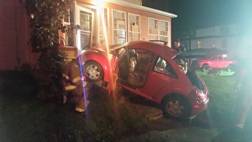 Waterville woman arrested after car crashes into house
