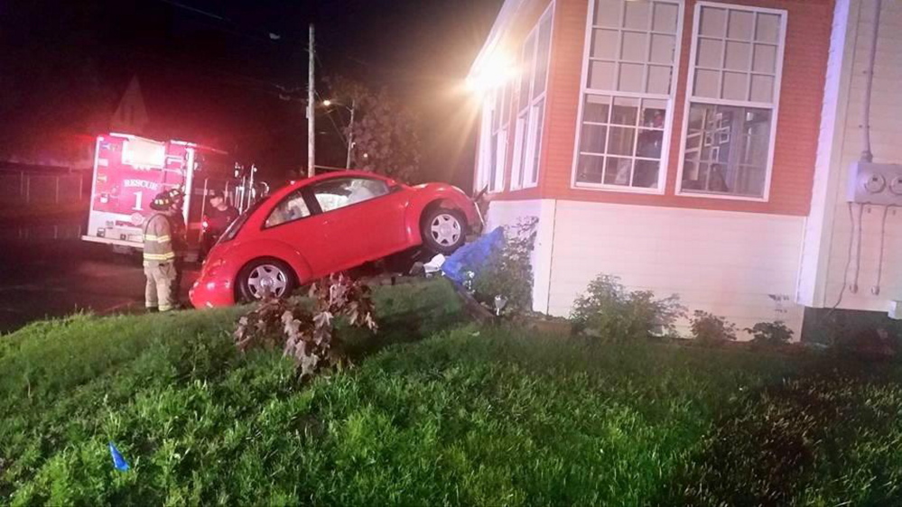 Waterville woman arrested after car crashes into house