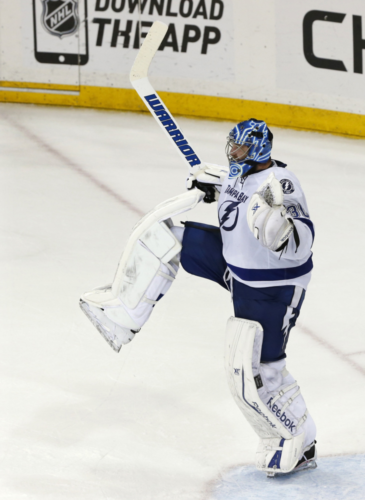 AP photo 
 Tampa Bay Lightning goalie Ben Bishop reacts as time winds off the clock to give the Lightning a 2-0 win over the Rangers in Game 7 of the Eastern Conference finals. Bishop played three seasons at the University of Maine, going 55-34-7.