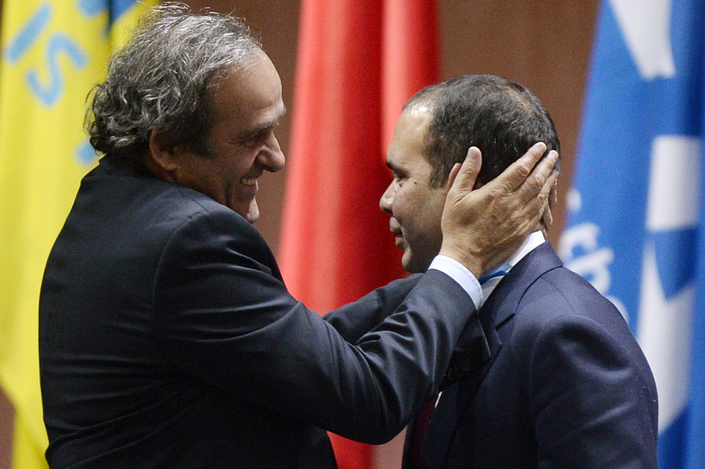 Prince Ali bin al-Hussein, right, is embraced by UEFA President Michel Platini, left, after al-Hussein announced his withdrawal in the FIFA president election at the 65th FIFA Congress at the Hallenstadion in Zurich, Switzerland last week. Michel Platini and al-Hussein are the likely candidates to succeed Sepp Blatter. But in an election where Africa and Asia hold almost half the votes, Cameroon’s Issa Hayatou and others may enter the race.