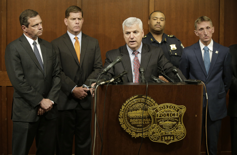 The Associated Press Suffolk County District Attorney Daniel F. Conley speaks as FBI Special Agent in Charge of Boston Vincent B. Lisi, left to right, Boston Mayor Marty Walsh and Boston Police Commissioner William B. Evans, far right, look on during a joint news conference at the Boston Police Department’s Headquarters Tuesday in Boston.