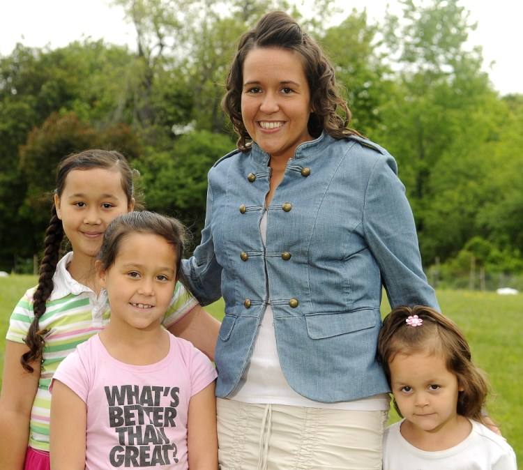 Jennifer Tantoco, 30, of Hallowell, will speak on Friday at her graduation from Augusta Adult Education. She earned her diploma while raising her three daughters, Kimora, 8, left rear; Nevaeh, 7, left front; and TiLynn, 4, right. The family was photographed Wednesday in Hallowell.