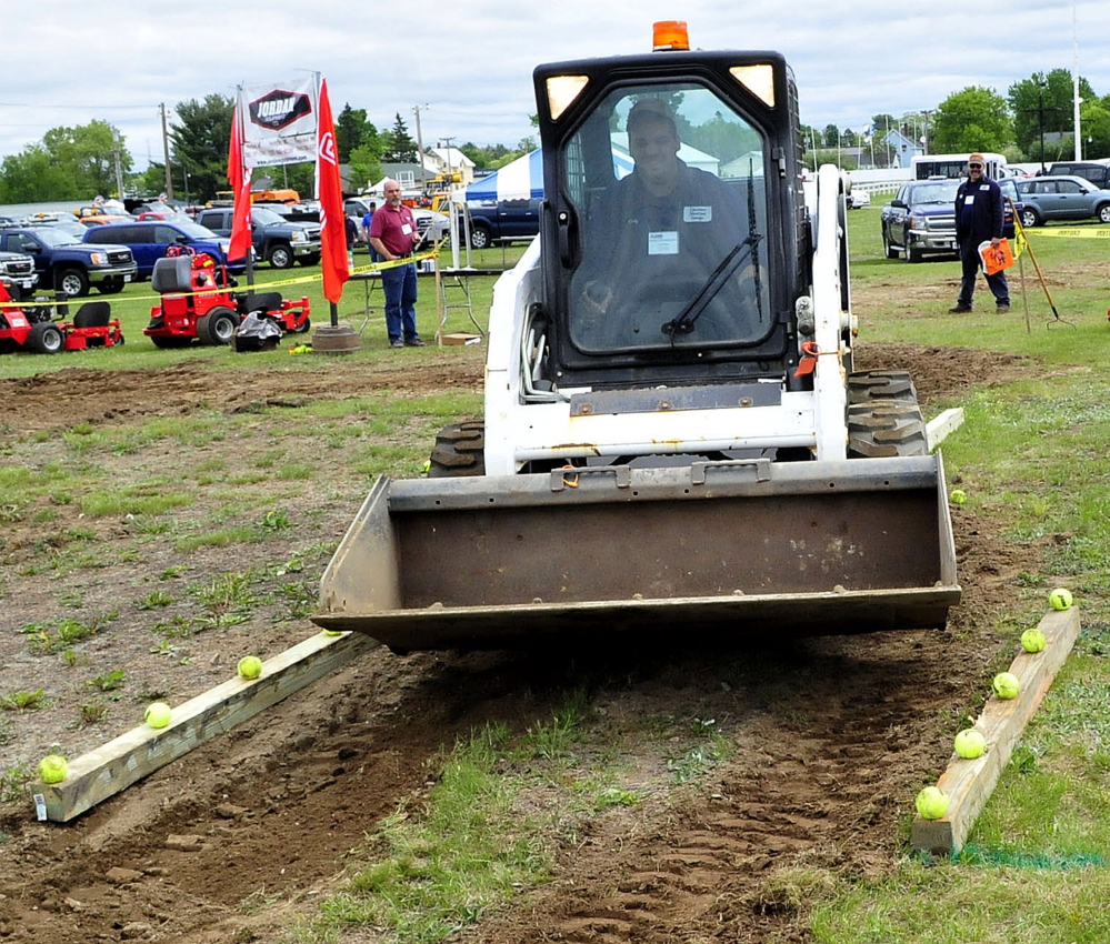 Cody Pleau competes in the skid steer competition Thursday during the American Public Works Highway Congress at the Skowhegan Fairgrounds.