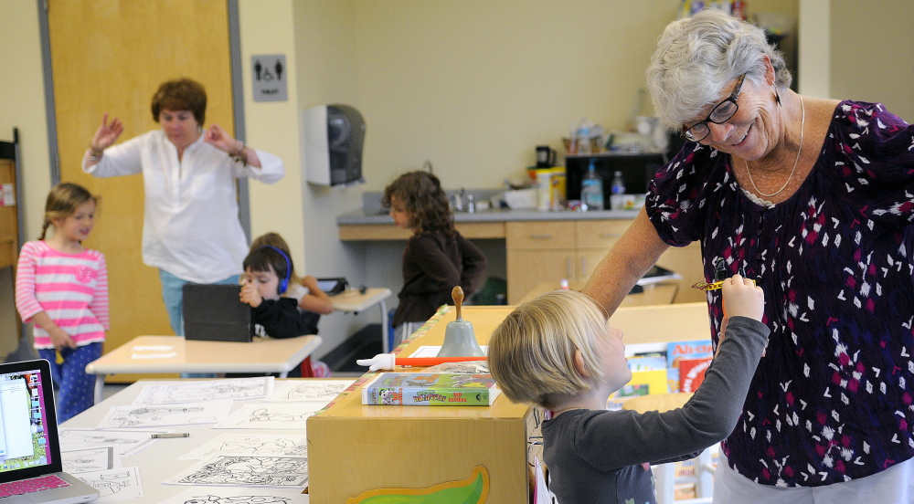 Hall-Dale Elementary School pre-kindergarten teacher Sue Dodge works with students earlier this week at the Hallowell school, where she has taught for more than 40 years. Dodge is retiring from a career she says she still loves.