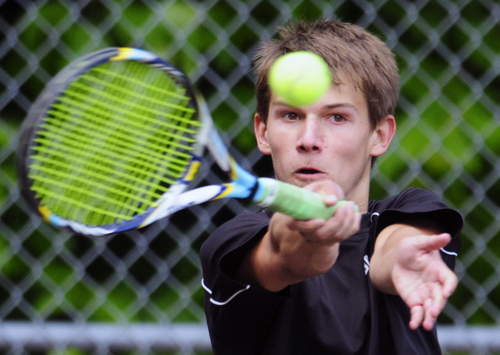Staff photo by Joe Phelan
Hall-Dale’s Jacob Young returns a shot to St. Dominic’s Elliot Hachey during the third singles match of a Western C semifinal against St. Dom’s on Friday in Farmingdale. Young won 6-4, 6-2.