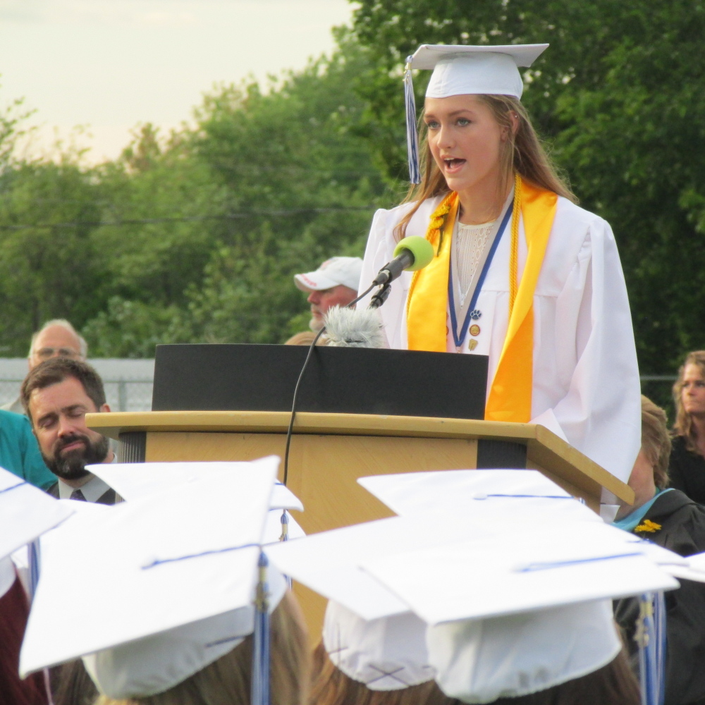 Lawrence High School Valedictorian Abigail Weigang addresses fellow graduates during a graduation ceremony Friday evening at the Lawrence High School football field in Fairfield.