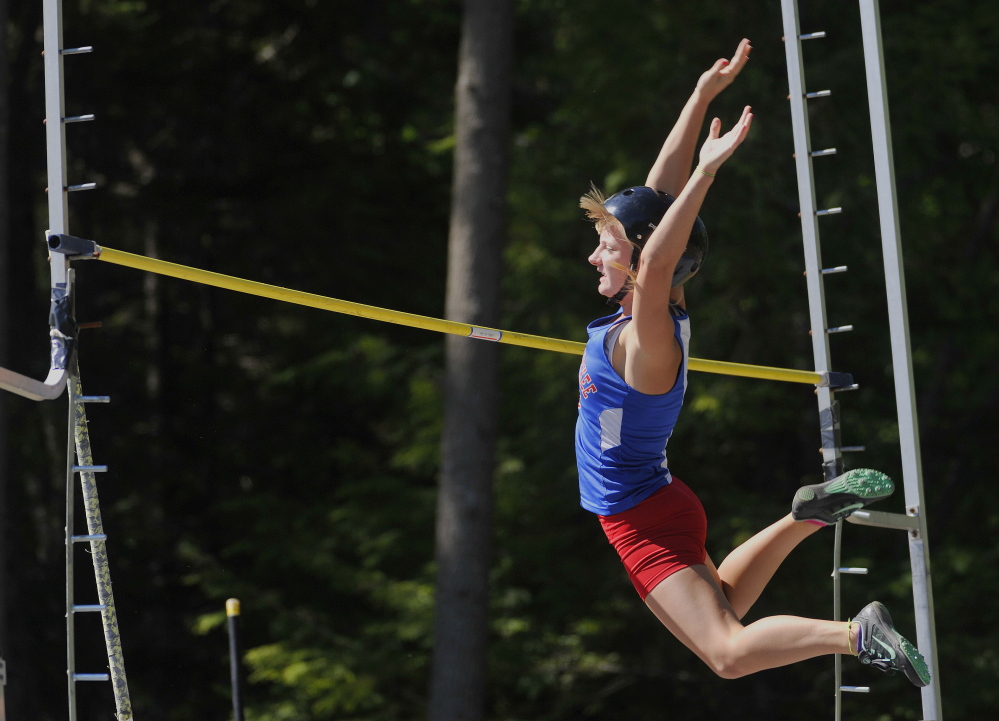 Portland Press Herald photo by John Ewing 
 Messalonskee's Taylor Lenentine clears the bar in the pole vault during the Class A state track and field championships Saturday at Mt. Ararat in Topsham. Lenentine won the event by clearing 10 feet.