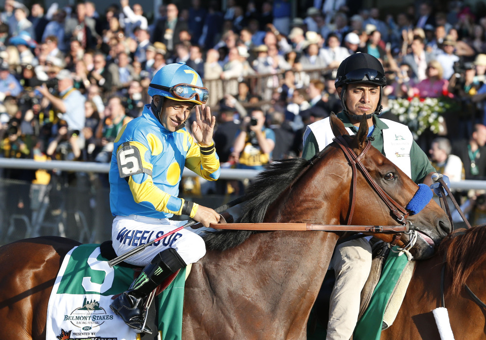 American Pharoah (5) with Victor Espinoza up parades to the starting gate before the 147th running of the Belmont Stakes horse race at Belmont Park, Saturday in Elmont, N.Y.