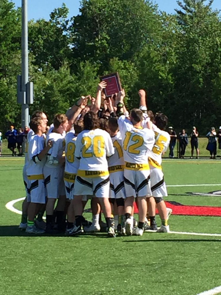 Staff photo by Dave DyerThe Maranacook/Winthrop boys lacrosse team celebrates its Kennebec Valley Athletic Conference Class B championship after defeating Gardiner 16-9 on Saturday at Smith Field in Waterville.