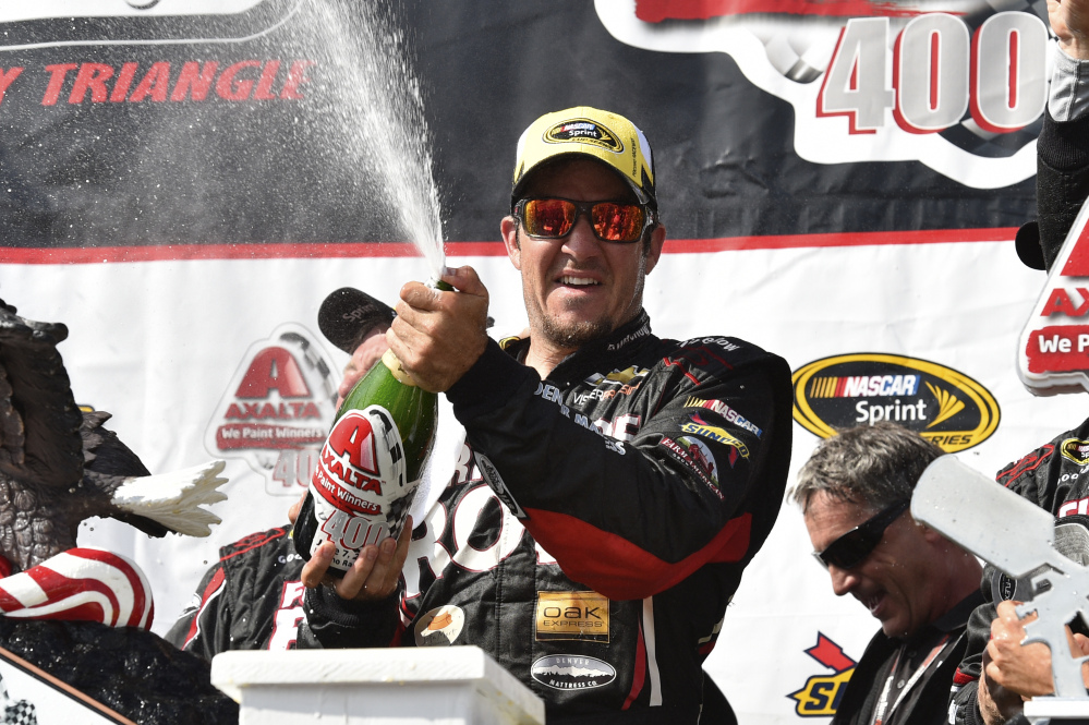 Martin Truex Jr. celebrates in Victory Lane after winning Sunday at Pocono Raceway in Long Pond, Pa.