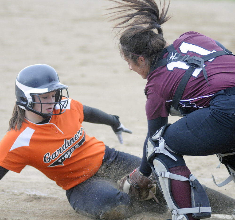 Gardiner Area High School’s Bri Brochu gets tagged at home by Nokomis catcher Mikayla Charters earlier this season in a Kennebec Valley Athletic Conference Class B game. No. 9 Nokomis will travel to Presque Isle on Tuesday for a preliminary-round game. Gardiner, the top seed in Eastern Class B, will play the winner of that game on Thursday.
