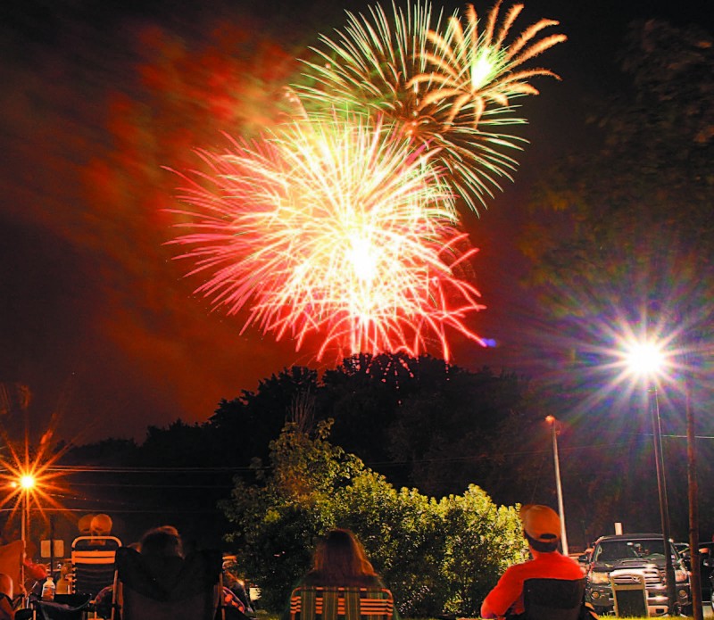 Fireworks light up the sky over the Hathaway Creative Center in Waterville on July 4 last year. The fireworks show was part of the Winslow Family 4th of July Celebration. Organizers of the annual event are meeting with Fairfield officials Wednesday  to discuss moving it to that town next year.