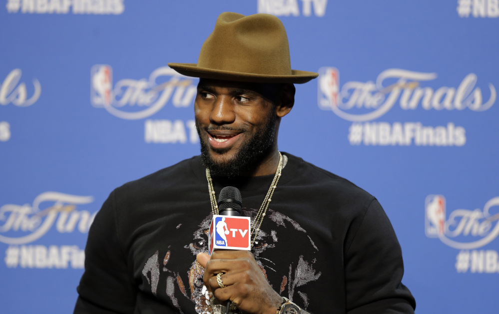 AP photo 
 Cleveland Cavaliers forward LeBron James answers a question during a press conference following Game 3 of the NBA Finals in Cleveland early Wednesday.