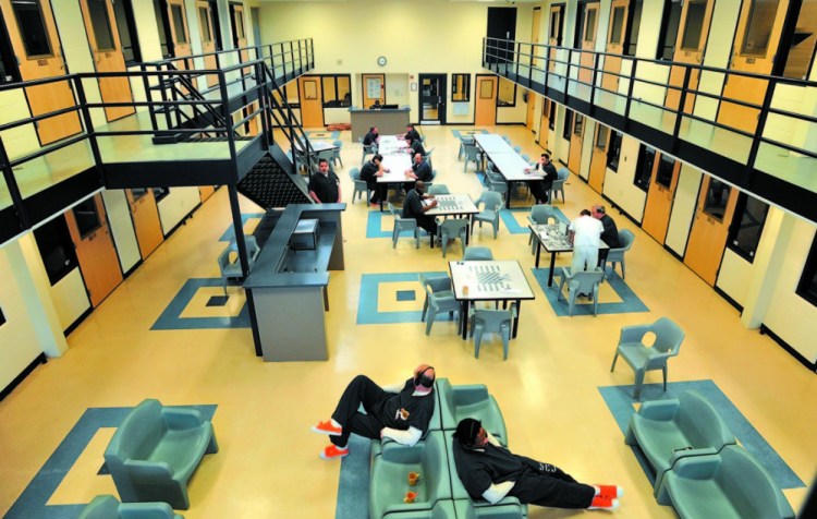 Inmates read and play board games in 2013 in the day room in the medium security wing at the Somerset County Jail in East Madison. The loss of income from housing federal inmates at the jail means a higher proposed county budget this year.