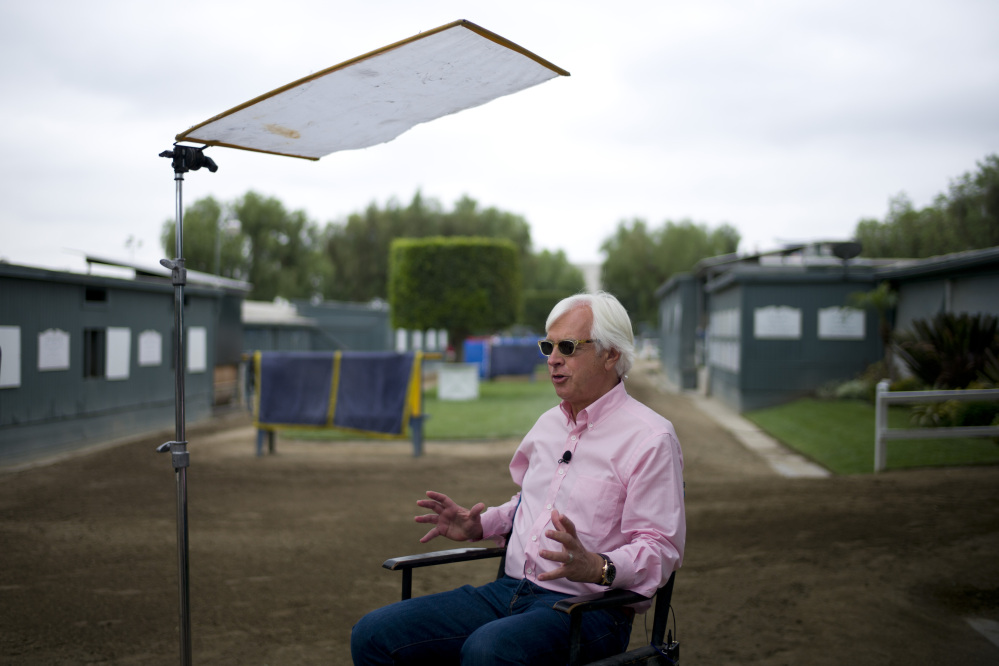 AP photo 
 Bob Baffert, the trainer for Triple Crown-winning horse American Pharoah, gives an interview with a television station at Santa Anita Park on Wednesday in Arcadia, Calif.