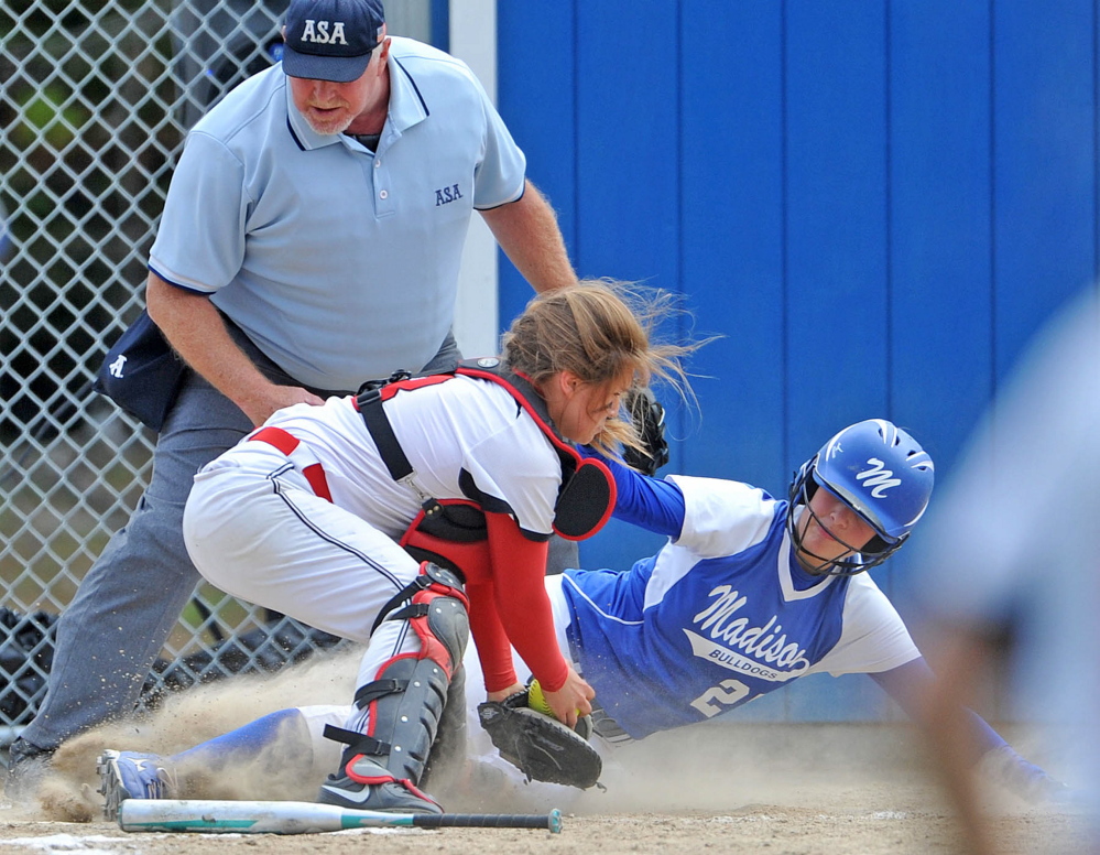Staff file photo by Michael G. Seamans 
 Madison's Erin Whalen, right, slides safely under the tag from Hall-Dale catcher Emma Begin during the Mountain Valley Conference title game recently. Madison and Hall-Dale are the top two seeds, respectively, in the Western C playoffs.