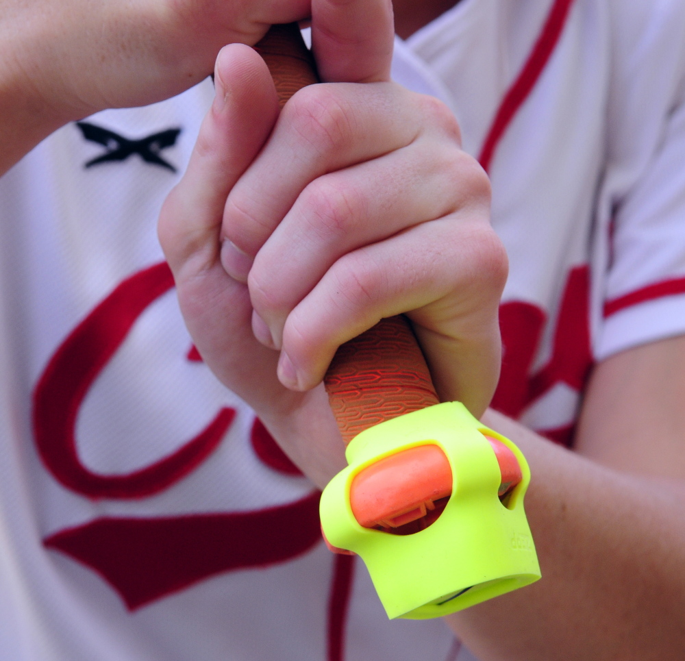 The Zepp sensor is seen on the end of bat held by Cony senior Arika Brochu on Thursday at Cony Family Field in Augusta.