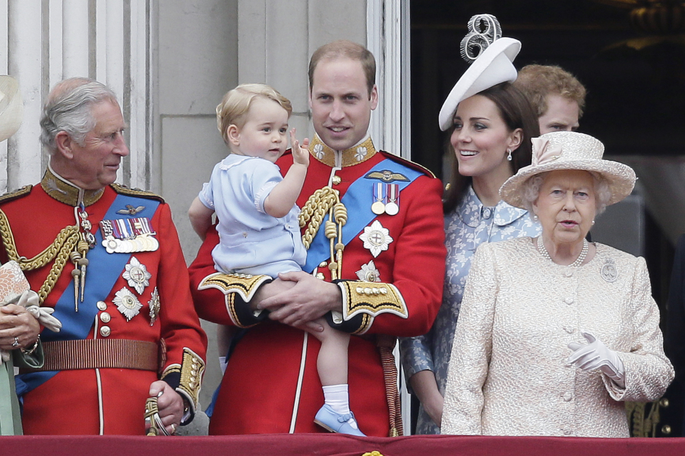Britain’s Prince William holds his son, Prince George, with Queen Elizabeth II, right, Kate, Duchess of Cambridge and the Prince of Wales during the Trooping The Colour parade at Buckingham Palace, in London on Saturday.
