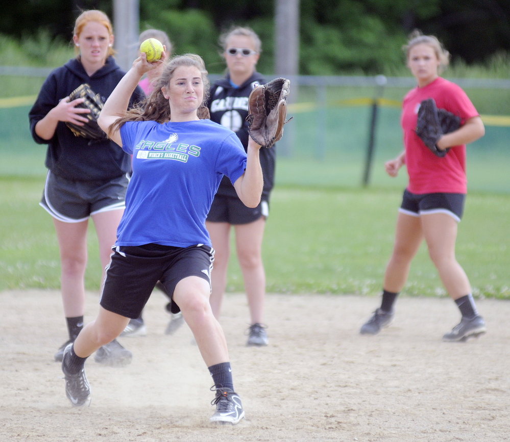 Gardiner Area High School’s Lauren Chadwick throws during practice in Gardiner. The Tigers will play Hermon for the Eastern B title tonight at Brewer High School.