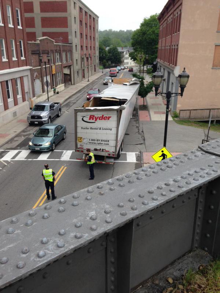A truck on Water Street in Augusta on Tuesday morning hit the train trestle bridge some call the “can opener.”