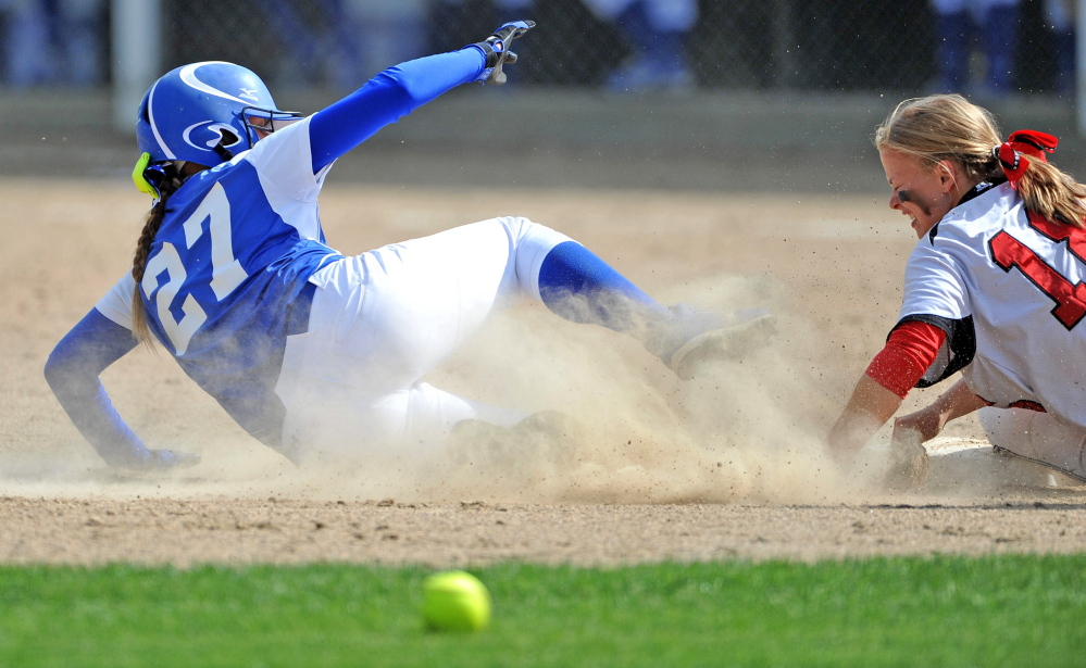 Madison baserunner Erin Whalen (27) slides safely into second base as Hall-Dale’s Eva Shepherd tries to handle the throw during the Mountain Valley Conference title game earlier this month. The Bulldogs will play for the Western C title on Wednesday.