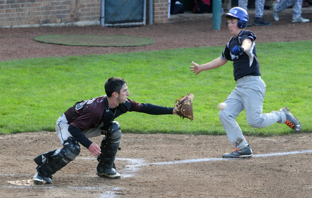 Richmond catcher Tyler Soucy waits for the throw to nab Searsport baserunner Kyle Moore at home during the Western D title game Tuesday at Larry Mahaney Diamond at St. Joseph’s College in Standish.
