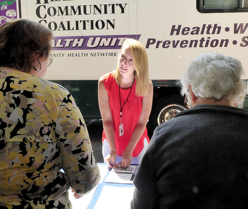 Laure Johnson, of Seniors Plus, speaks with attendees Thursday at the Senior Resource Fair in Wilton. Johnson was a keynote speaker at the event.