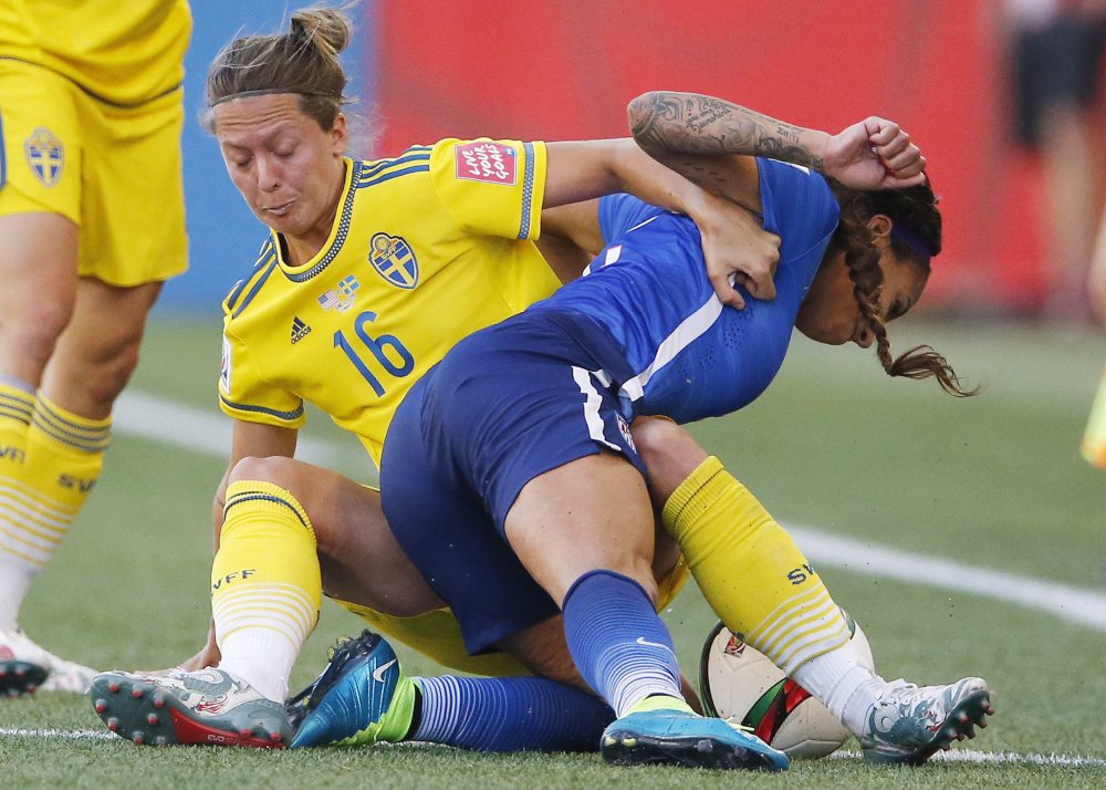 AP photo 
 In this June 12 photo, Sweden's Lina Nilsson (16) hauls down United States' Sydney Leroux (2) during the second half of a Women's World Cup match in Winnipeg, Manitoba, Canada.