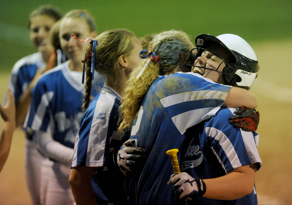 Staff photo by Michael G. Seamans 
 Messalonskee High School's Kirsten Pelletier, left, celebrates with teammate Hannah Duperry after the Eagles toppled Bangor 3-2 in eight innings of the Eastern A title game Wednesday night. The Eagles will play Scarborough in the Class A state game on Saturday at noon.