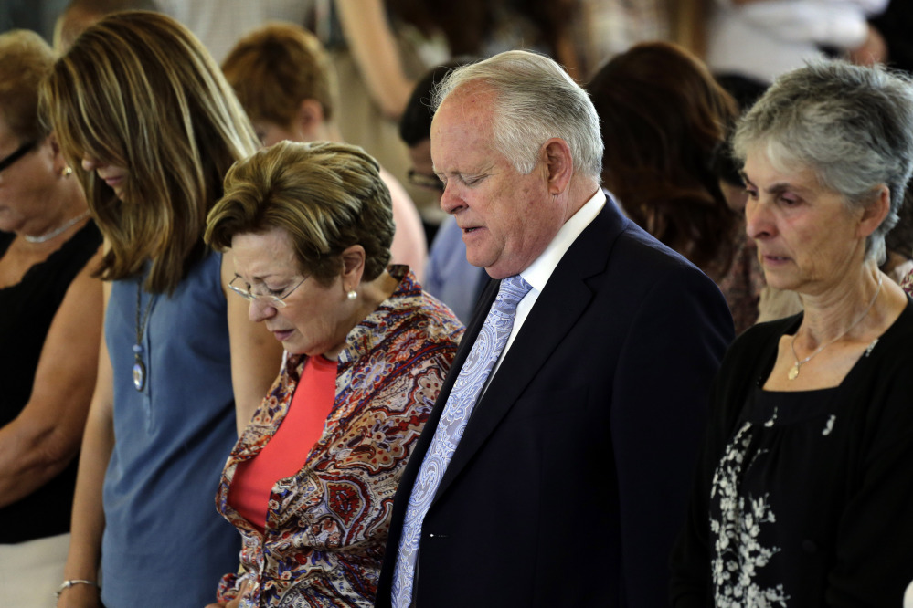 The Associated Press Robert Tansill Oliver, centre right and Maribel Calvo, the parents of Robert Oliver Calvo, a businessman who was on board of the Germanwings jet which crashed in the French Alps, pray, during a religious funeral service, in Montcada, near Barcelona, Spain, Saturday.