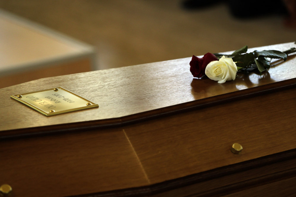 The Associated Press Flowers on top of a coffin with the remains of Robert Oliver Calvo, on a business trip when the Germanwings jet he was in crashed in the French Alps, during a religious funeral service in Montcada, near Barcelona, Spain, Saturday.