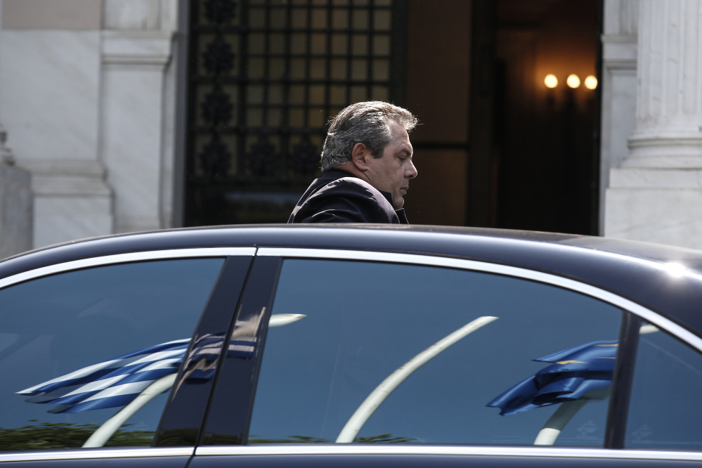 Greece’s Defense Minister Panos Kamenos arrives for a cabinet meeting at Greek Prime Minister’s office in Athens, Greece, on Sunday.