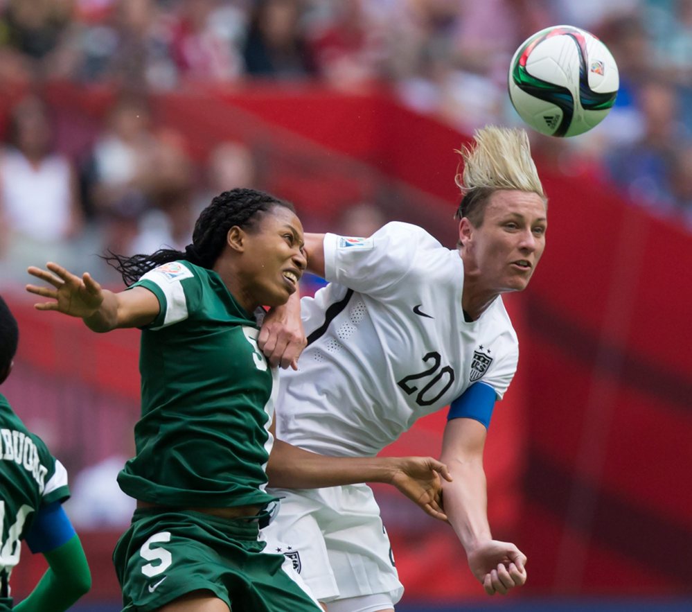 Nigeria’s Onome Ebi, left, and United States’ Abby Wambach vie for the ball during the second half of a FIFA Women’s World Cup game last week. The United States plays Colombia on Monday.