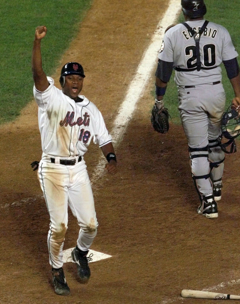 The Associated Press In this Aug. 23, 1999, file photo, New York Mets’ Darryl Hamilton celebrates as he scores the game-winning run on a Matt Franco hit to left field in the bottom of the ninth inning that gave the Mets a 3-2 victory over the Houston Astros in a baseball game at Shea Stadium in New York.