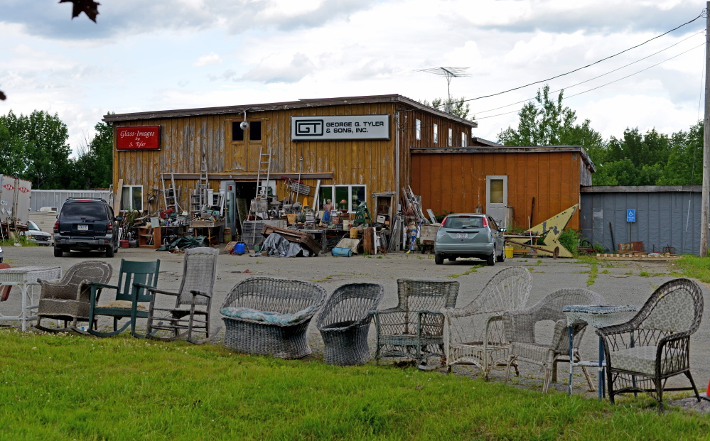 Fairfield Antiques on U.S. Route 201, shown Friday, while not as clean as the town wants it, is significantly cleaner that it was when complaints were first filed against owner Robert Dale.