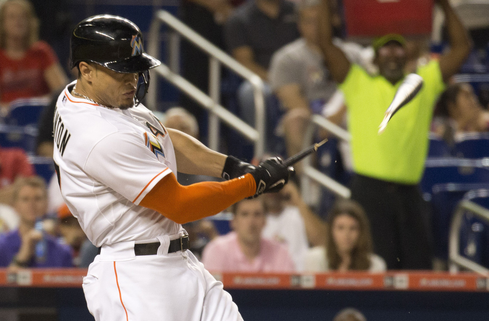 Miami’s Giancarlo Stanton broke his left hand swinging a bat Friday night against the Dodgers. He is expected to be out 4 to 6 weeks.