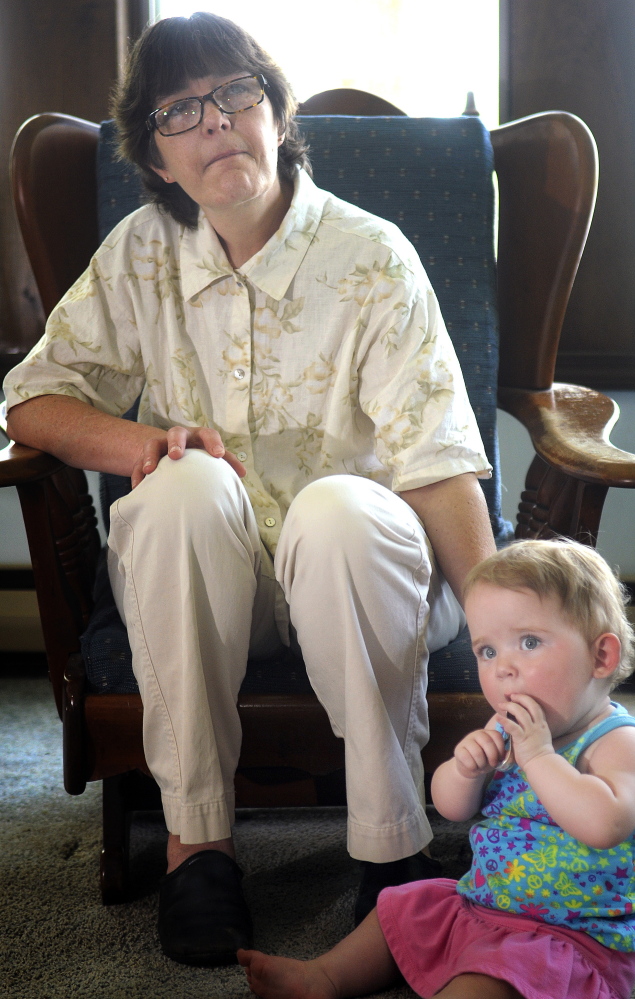 Donna Lufkin, of Gardiner, with Cheyenne, an 11-month-old she has guardianship over during a recent meeting in Belgrade of the Augusta Area Kinship Support group for grandparents raising their grandchildren.