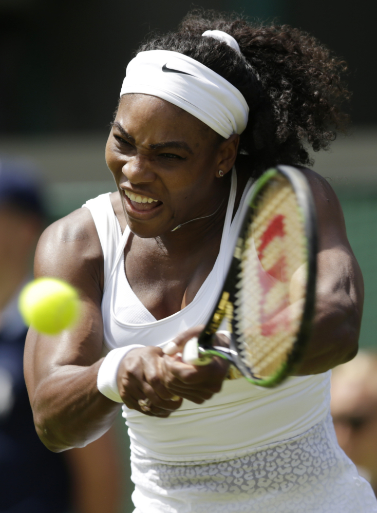 Serena Williams of the United States plays a return to Margarita Gasparyan of Russia in a women’s singles first round match at the All England Lawn Tennis Championships in Wimbledon, London.